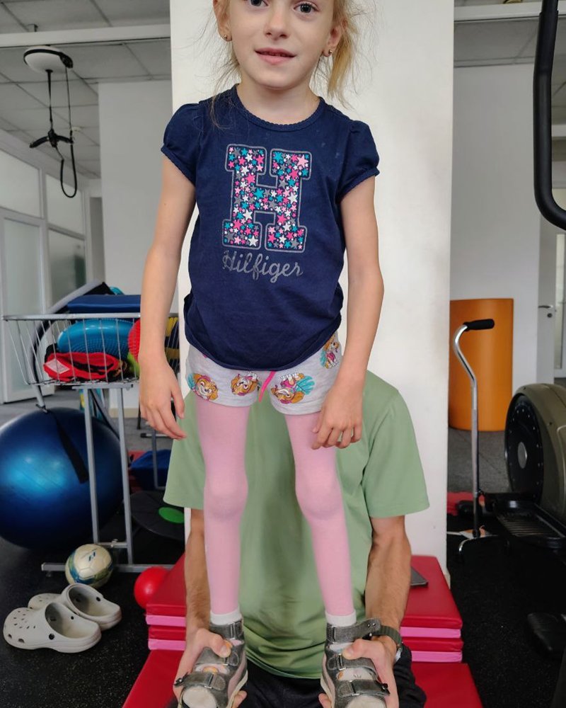 Ariana standing during a rehabilitation session