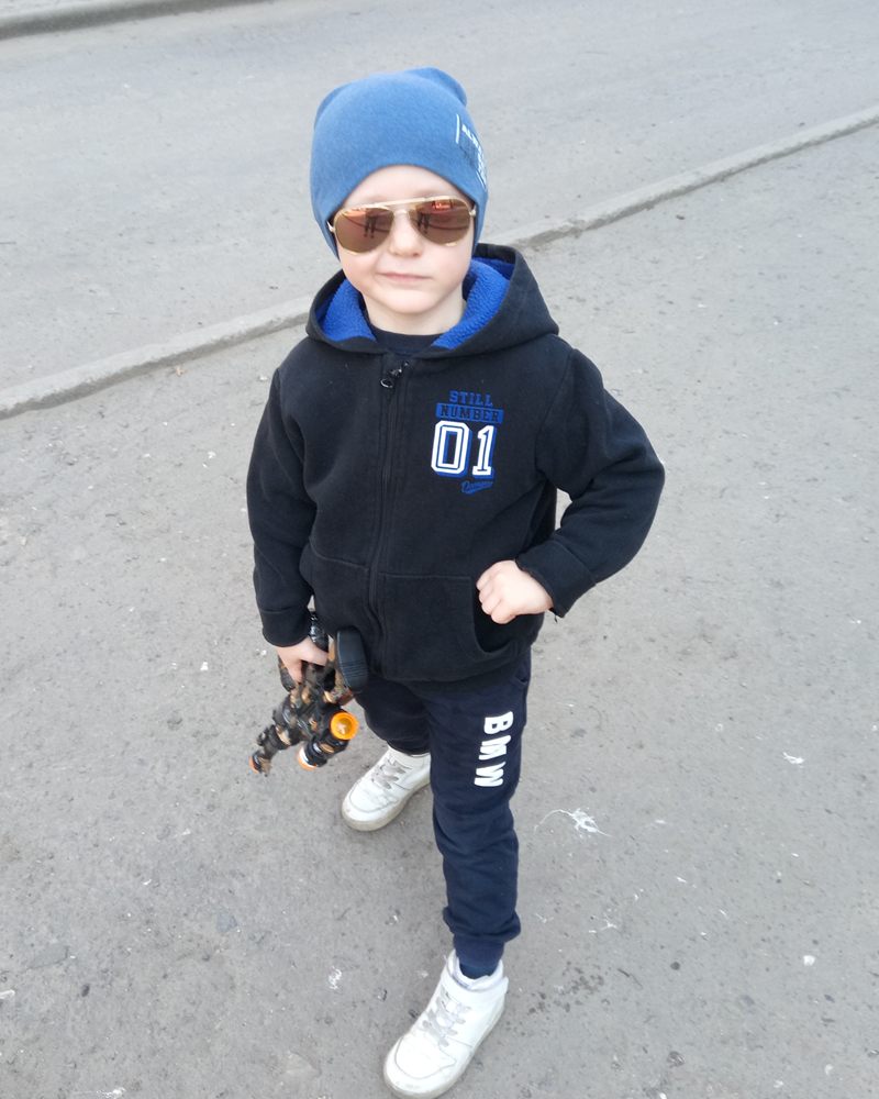 Bogdan outdoors in sunglasses and a warm hat